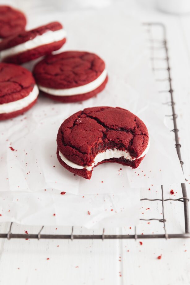 red velvet sandwich cookies with white chocolate frosting