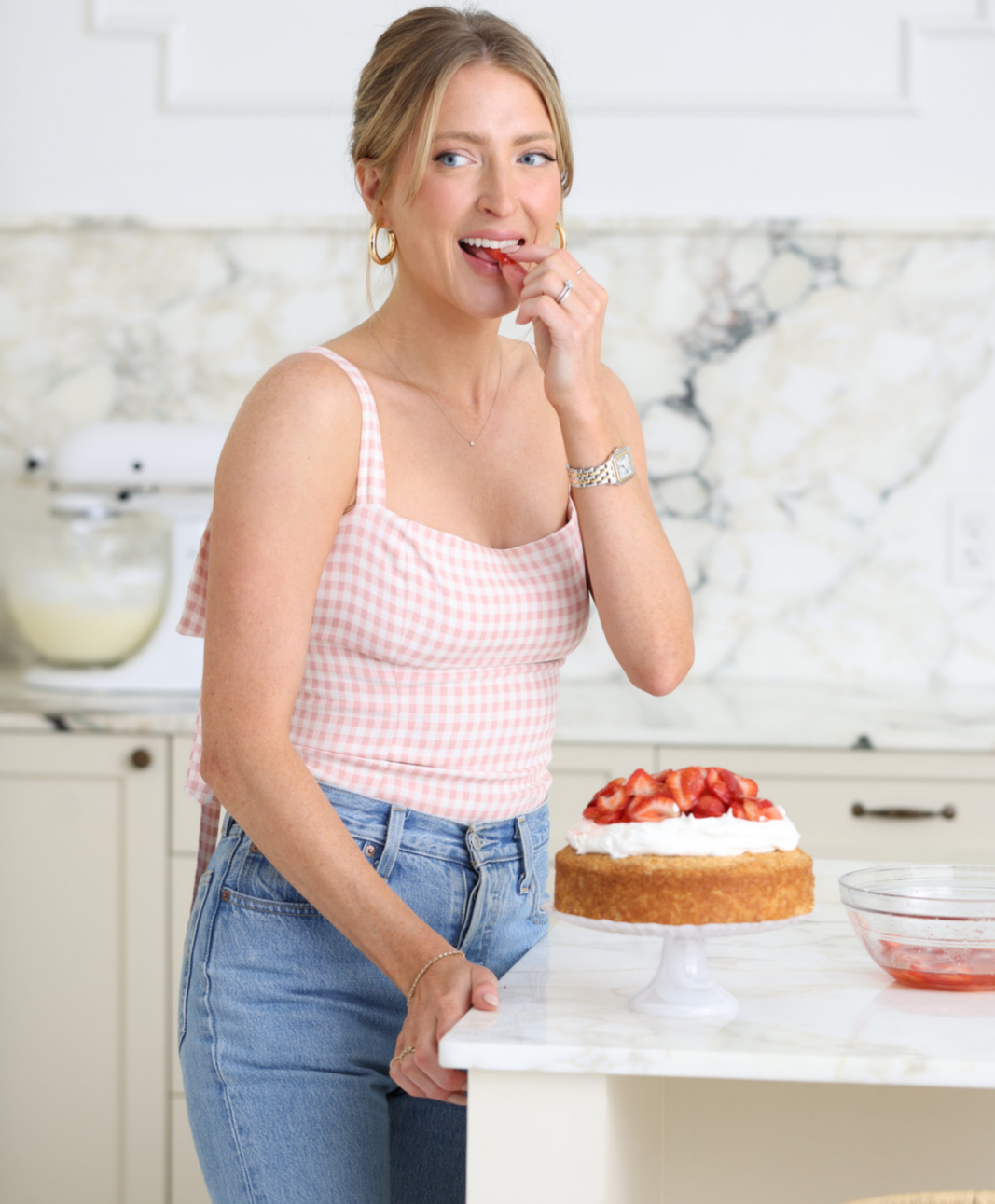 sarah tasting cake in the kitchen