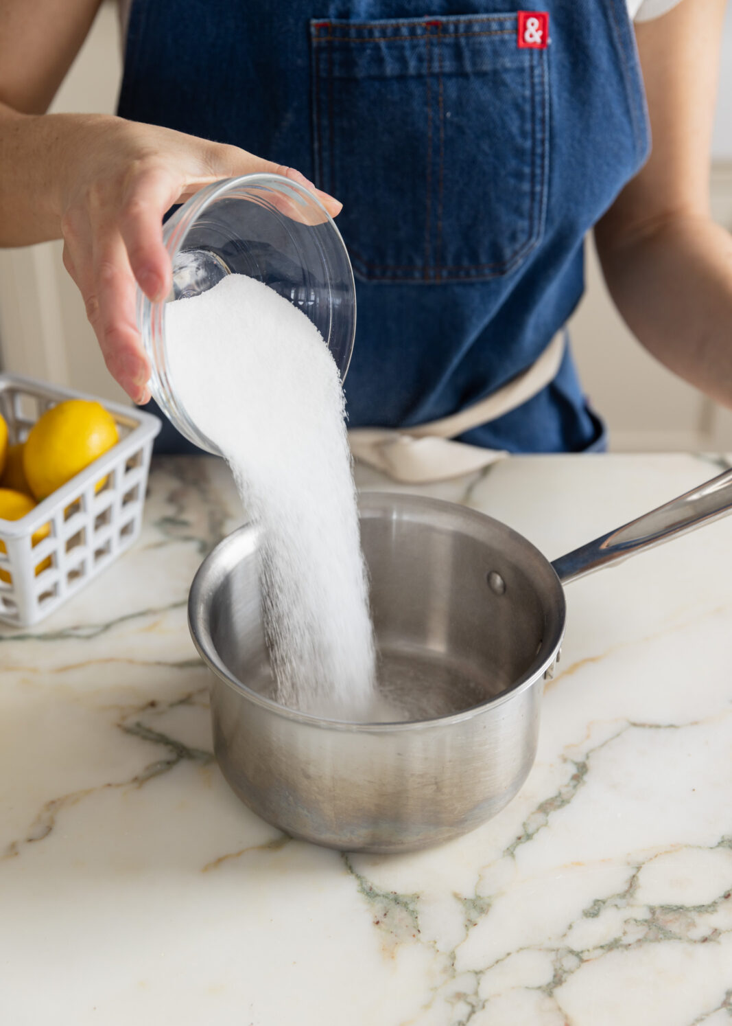 sugar going into a pan