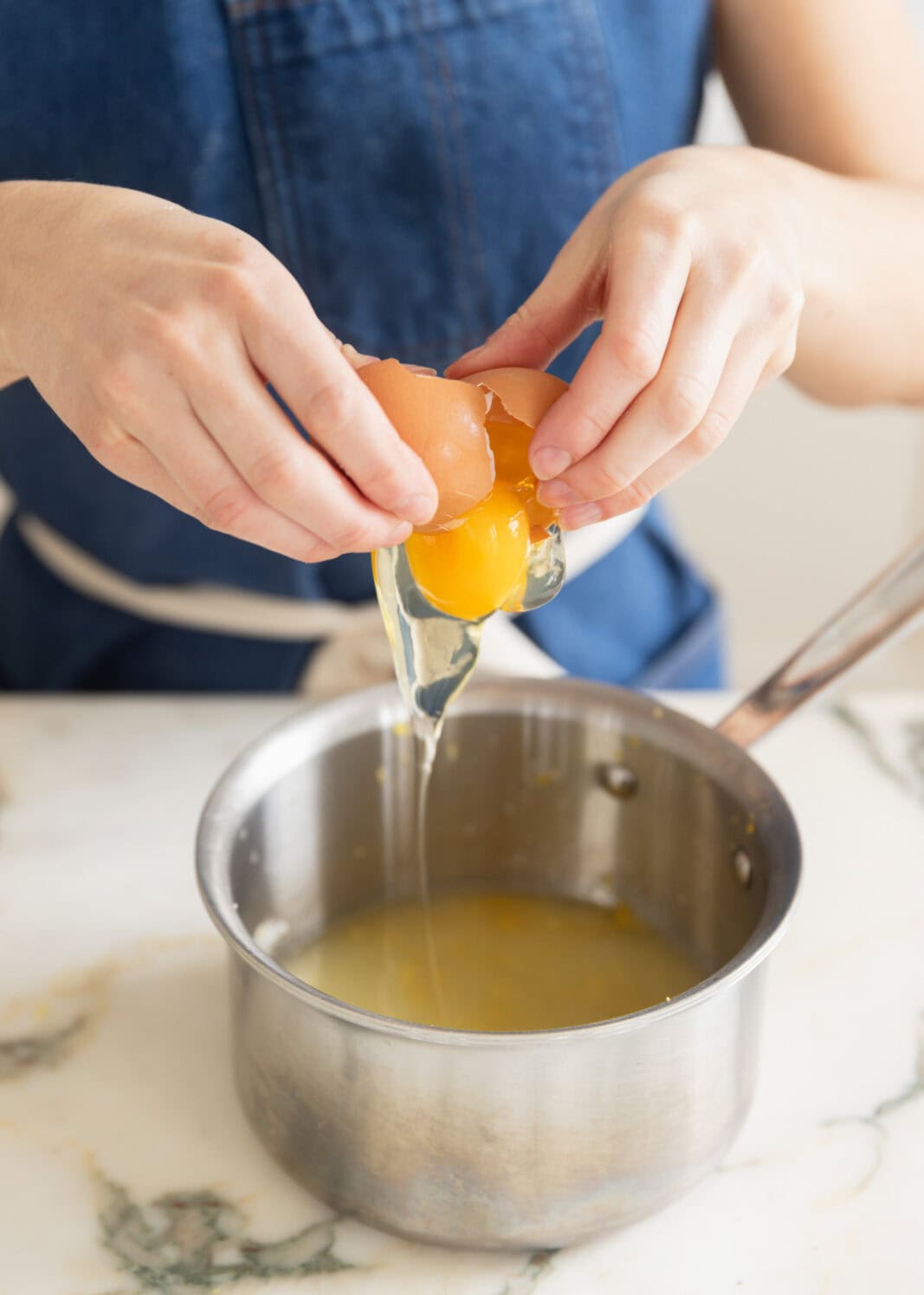 adding eggs to lemon curd